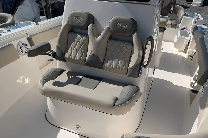 Slide: The Image of 2026 Key West 263 FS boat interior with cushioned seating and modern design. - 17