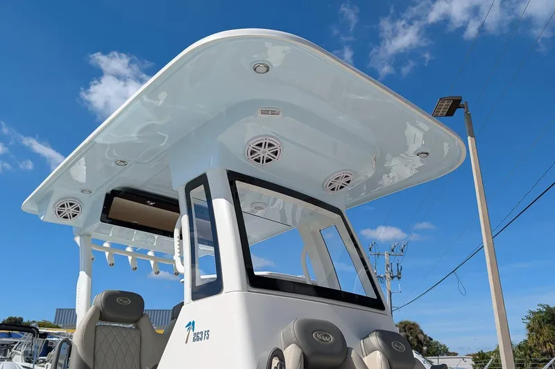 Slide: The Image of 2026 Key West 263 FS boat with T-top under clear blue sky. - 23