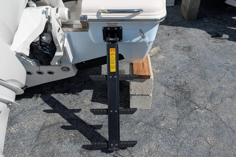 Slide: The Image of Rear view of 2026 Key West 263 FS boat with ladder and engine details. - 5