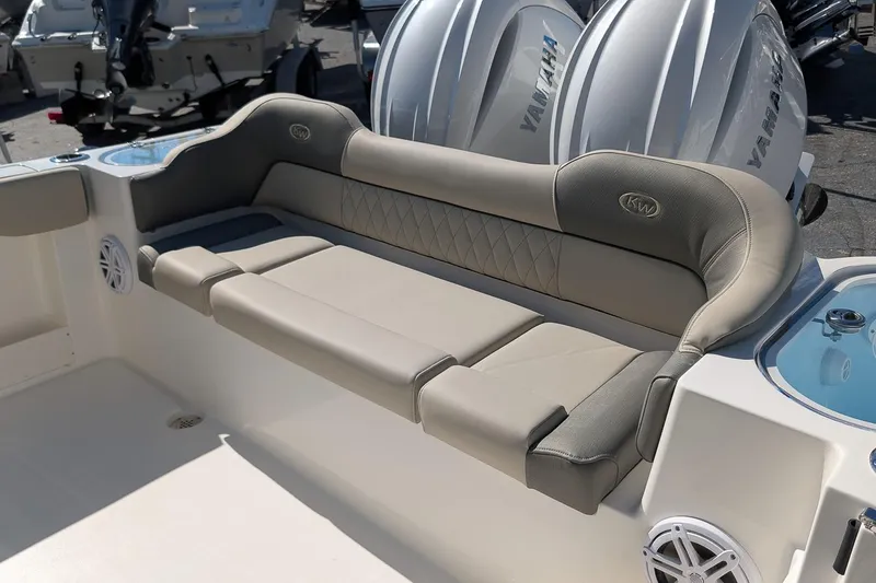 Slide: The Image of 2026 Key West 263 FS boat with cushioned seating and Yamaha engines. - 8