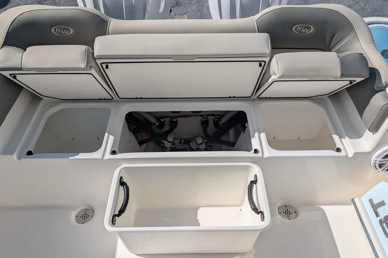 Slide: The Image of 2026 Key West 263 FS boat interior with storage compartments and seating. - 9