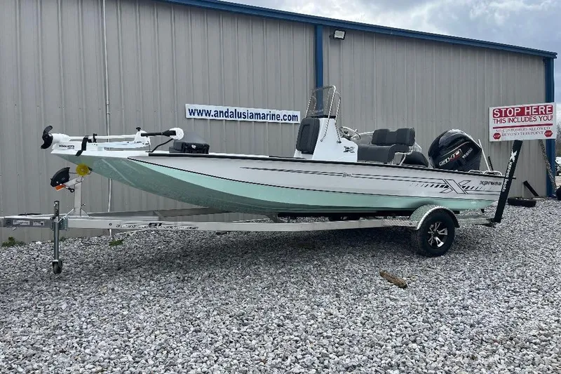 The Image of 2026 Xpress H20B Bay boat on trailer, displayed outside Andalusia Marine. - 0