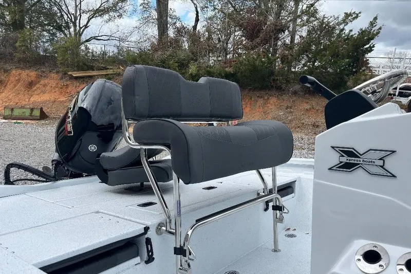 Slide: The Image of 2026 Xpress H20B Bay boat with Yamaha engine, featuring sleek seating and console design. - 3