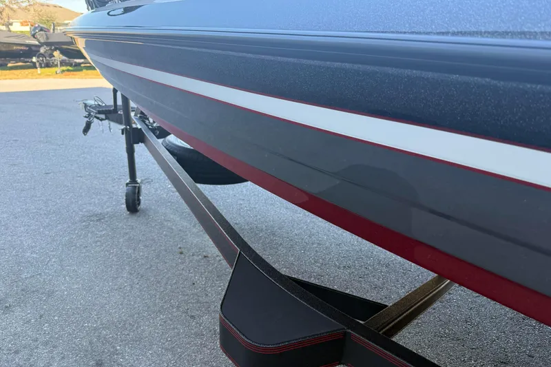 Slide: The Image of 2026 Skeeter FXR20 boat on trailer, showcasing sleek design and detailing. - 3