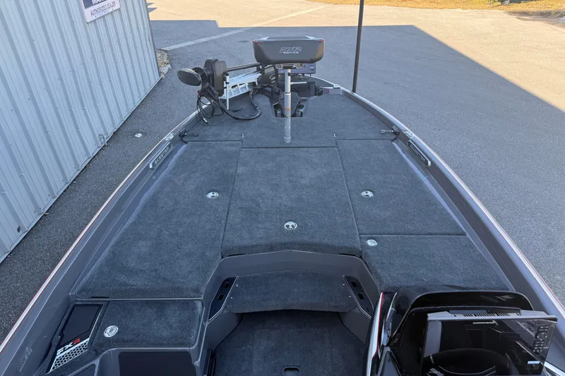 Slide: The Image of 2026 Skeeter FXR20 boat deck with advanced fishing equipment and storage compartments. - 6