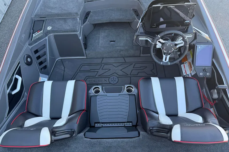 Slide: The Image of 2026 Skeeter FXR20 boat interior with dual seats, steering wheel, and control panel. - 8