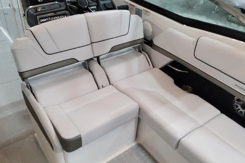 Slide: The Image of 2026 Formula 310 Bowrider I/O interior with luxurious white seating and modern design. - 11