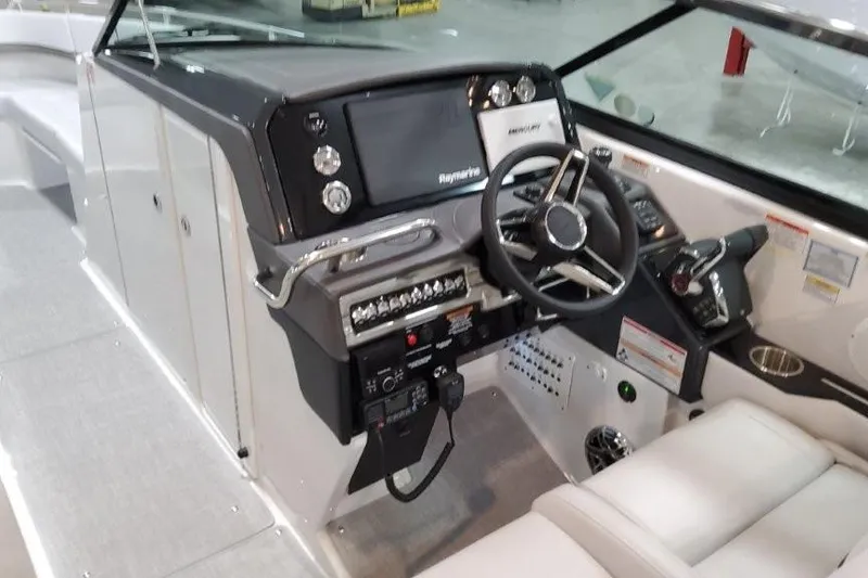 Slide: The Image of 2026 Formula 310 Bowrider I/O dashboard with modern controls and navigation system. - 13