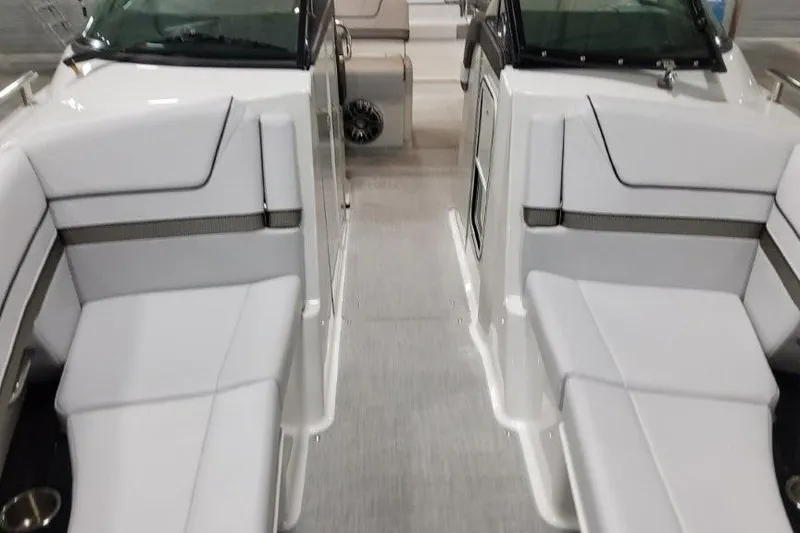 Slide: The Image of 2026 Formula 310 Bowrider I/O interior with sleek white seating and modern design. - 21