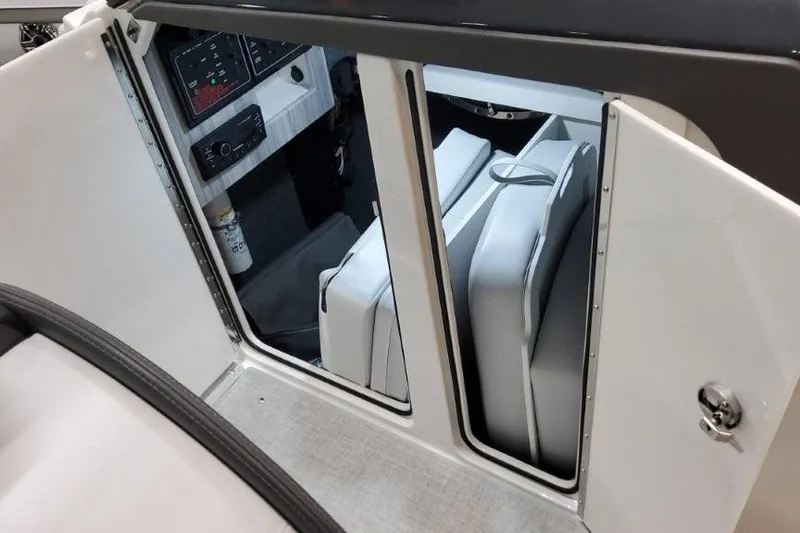 Slide: The Image of 2026 Formula 310 Bowrider I/O interior cabin with seating and control panel. - 24