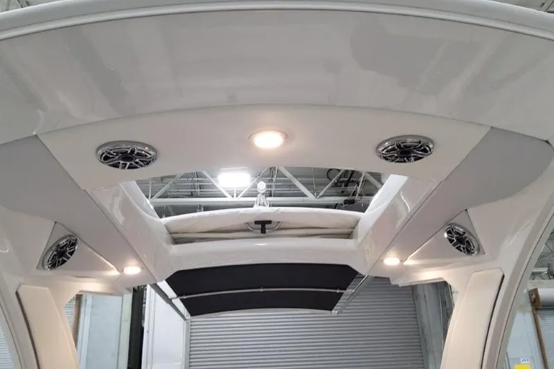 Slide: The Image of Interior view of 2026 Formula 310 Bowrider I/O boat with speakers and lighting. - 26