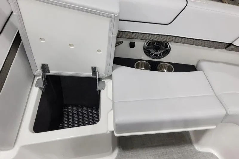Slide: The Image of 2026 Formula 310 Bowrider I/O interior with storage compartment and cup holders. - 29