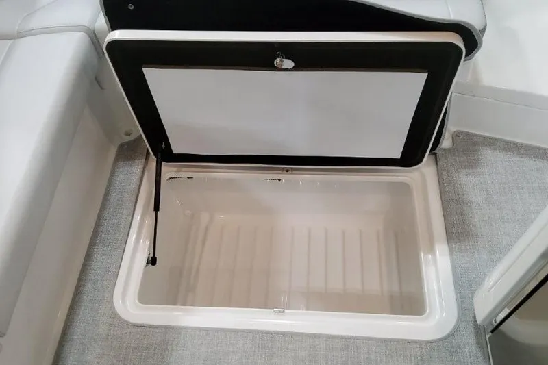 Slide: The Image of Open storage compartment in 2026 Formula 310 Bowrider I/O boat interior. - 31