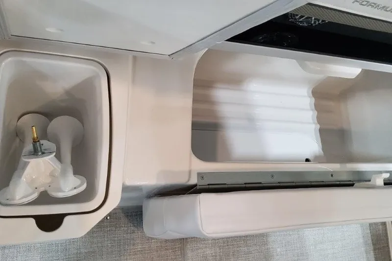 Slide: The Image of 2026 Formula 310 Bowrider I/O interior storage compartments and seating detail. - 32