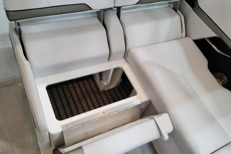 Slide: The Image of 2026 Formula 310 Bowrider I/O interior seating with storage compartment open. - 33