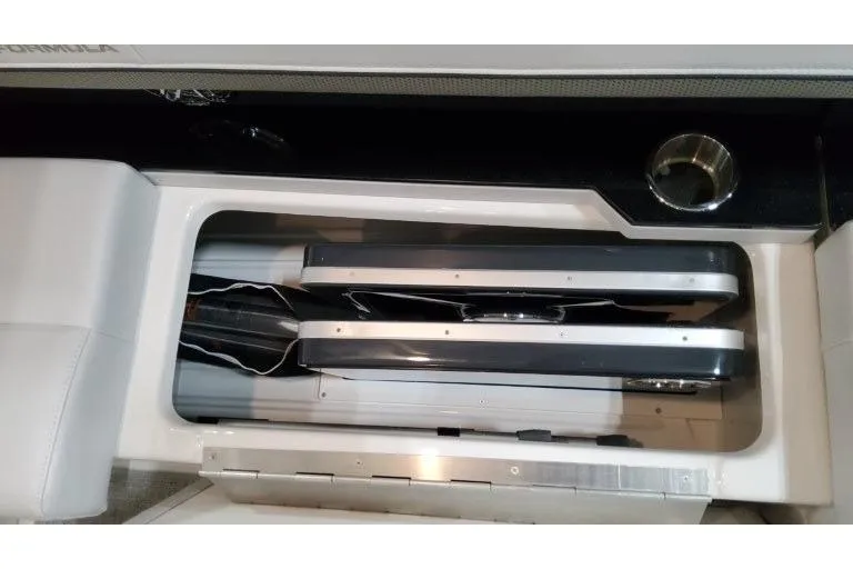 Slide: The Image of 2026 Formula 310 Bowrider I/O storage compartment with neatly organized equipment. - 34