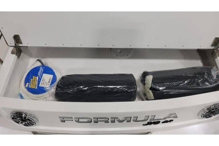 Slide: The Image of 2026 Formula 310 Bowrider I/O storage compartment with accessories and equipment. - 36