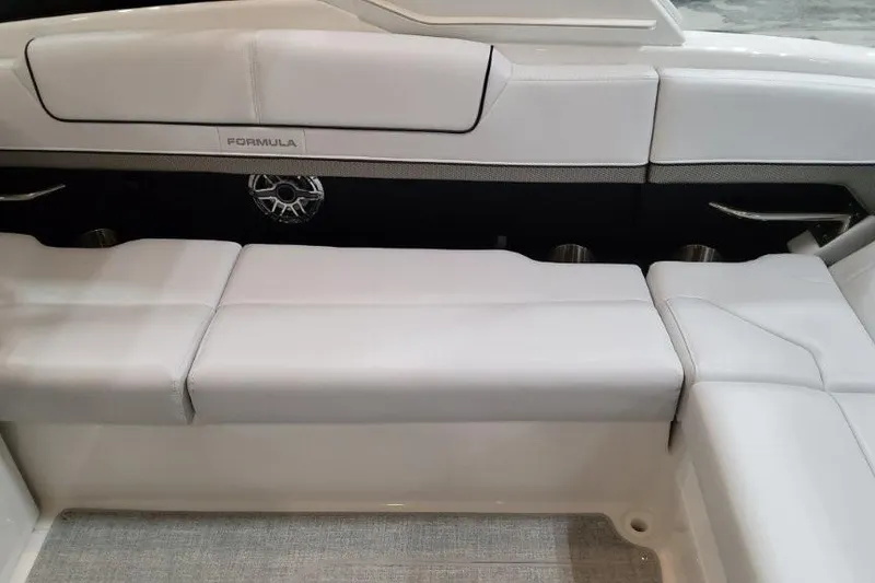 Slide: The Image of 2026 Formula 310 Bowrider I/O interior seating with sleek white upholstery and modern design. - 39
