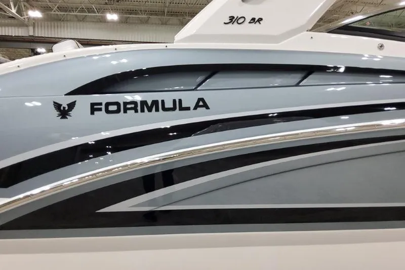 Slide: The Image of 2026 Formula 310 Bowrider I/O boat with sleek design and modern graphics. - 6