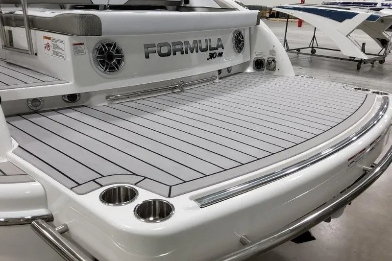 Slide: The Image of 2026 Formula 310 Bowrider I/O boat with spacious swim platform and sleek design. - 7