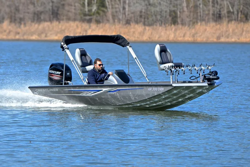 The Image of 2017 Crestliner VT 17 boat cruising on a lake with a Mercury engine. - 1