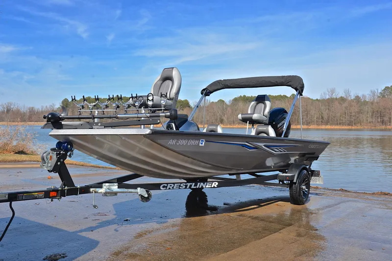 Slide: The Image of 2017 Crestliner VT 17 fishing boat on trailer by a lake. - 10