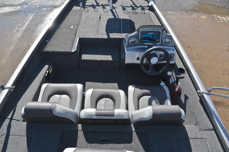 Slide: The Image of 2017 Crestliner VT 17 boat interior with steering console and seating arrangement. - 20