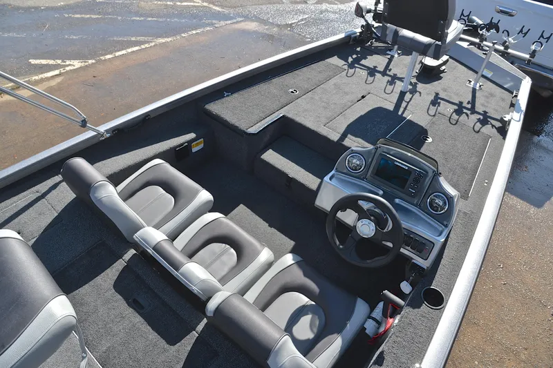 Slide: The Image of 2017 Crestliner VT 17 boat interior with steering console and seating arrangement. - 23