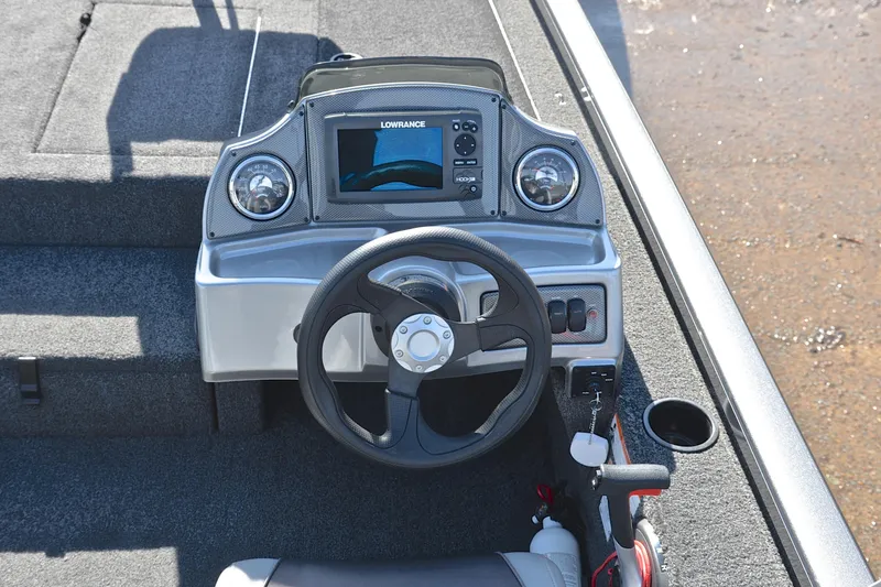 Slide: The Image of 2017 Crestliner VT 17 boat dashboard with steering wheel and Lowrance display. - 24
