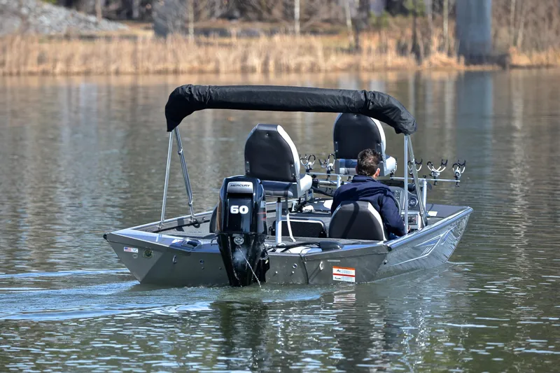 Slide: The Image of 2017 Crestliner VT 17 boat on calm lake with Mercury 60 engine. - 8