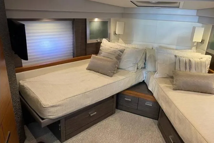 Slide: The Image of 2019 Tiara Yachts F53 Flybridge cruising on open water, aerial view. - 10