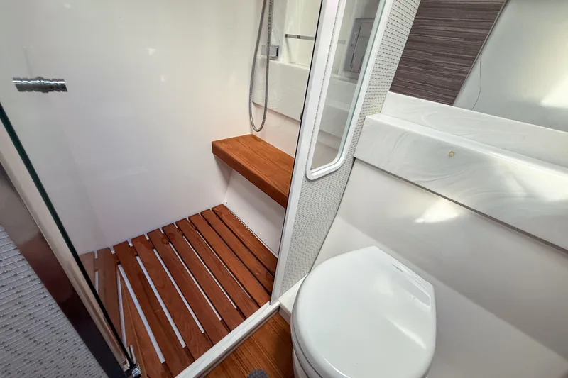 Slide: The Image of Luxurious bathroom in 2019 Tiara Yachts F53 Flybridge with wooden shower floor. - 110