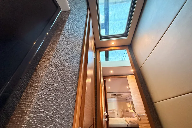 Slide: The Image of Interior view of 2019 Tiara Yachts F53 Flybridge with skylight and modern design. - 112