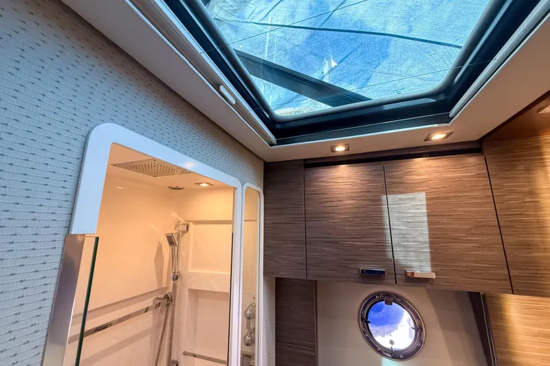 Slide: The Image of Luxurious interior of 2019 Tiara Yachts F53 Flybridge with skylight and modern shower. - 115