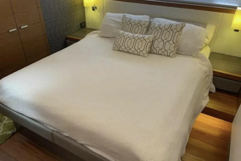 Slide: The Image of 2019 Tiara Yachts F53 Flybridge cruising on open water. - 12