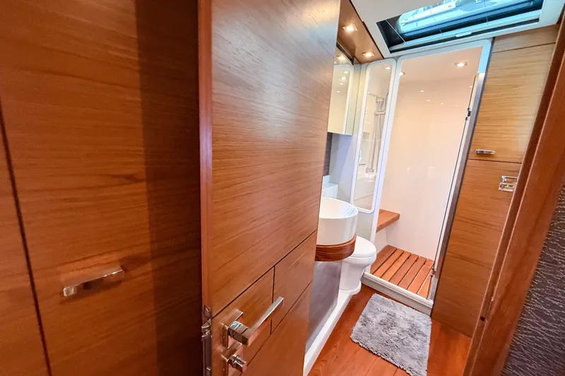 Slide: The Image of Luxurious bathroom interior of 2019 Tiara Yachts F53 Flybridge with wood accents and modern fixtures. - 120