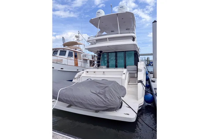 Slide: The Image of 2019 Tiara Yachts F53 Flybridge docked, showcasing sleek design and spacious flybridge. - 121