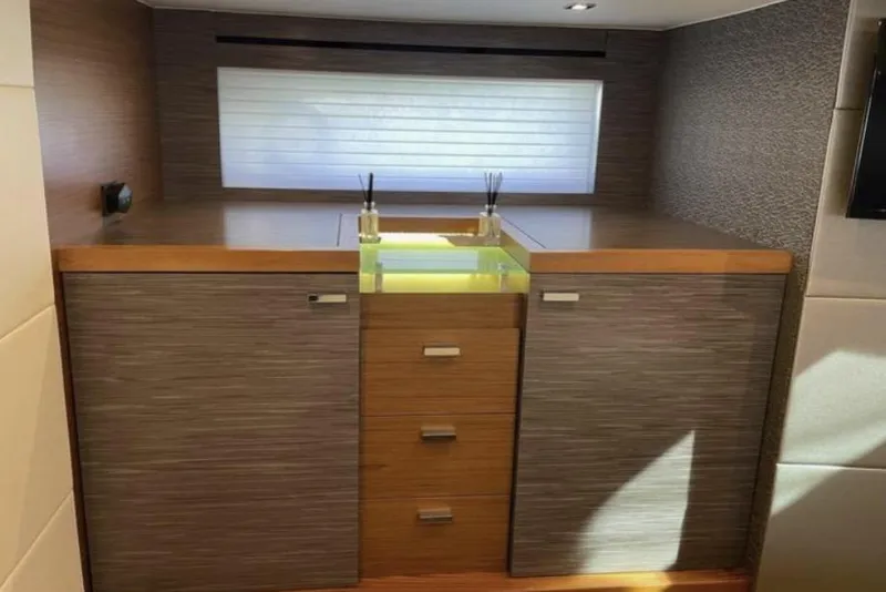 Slide: The Image of 2019 Tiara Yachts F53 Flybridge cruising on open water. - 13