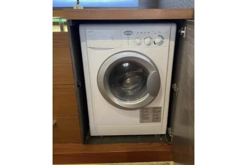 Slide: The Image of 2019 Tiara Yachts F53 Flybridge cruising on open water. - 14