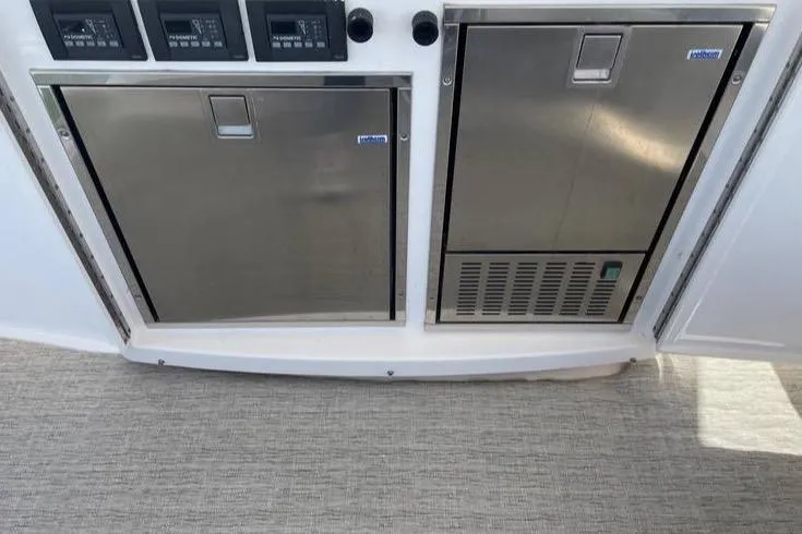 Slide: The Image of 2019 Tiara Yachts F53 Flybridge cruising on open water. - 15