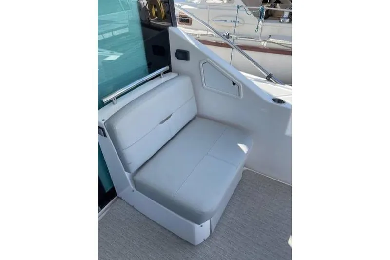 Slide: The Image of 2019 Tiara Yachts F53 Flybridge cruising on open water. - 16