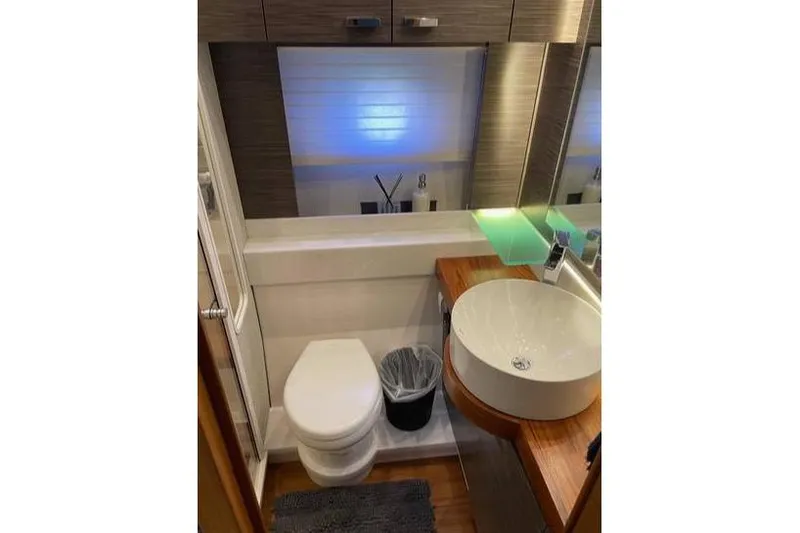 Slide: The Image of 2019 Tiara Yachts F53 Flybridge cruising on open water. - 23