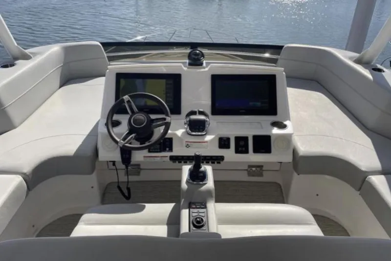 Slide: The Image of 2019 Tiara Yachts F53 Flybridge cruising on open water. - 3