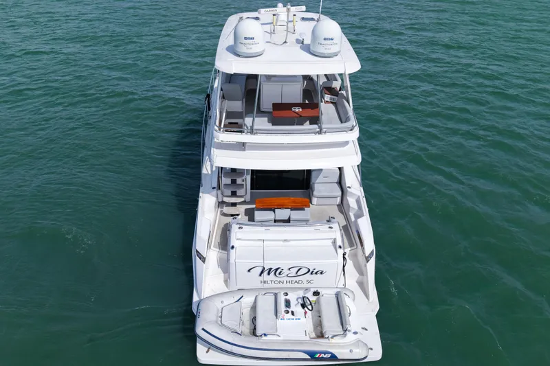 Slide: The Image of 2019 Tiara Yachts F53 Flybridge on water, rear view with flybridge and seating. - 30