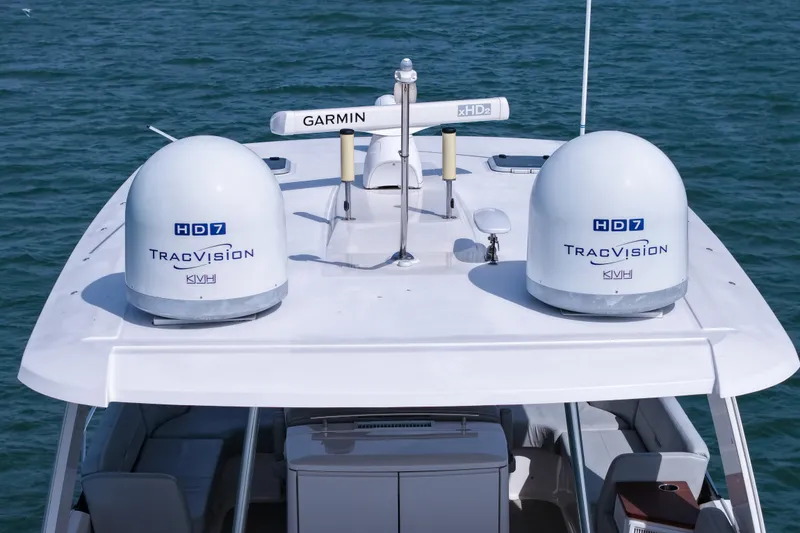 Slide: The Image of 2019 Tiara Yachts F53 Flybridge with TracVision HD7 satellite domes on the roof. - 32