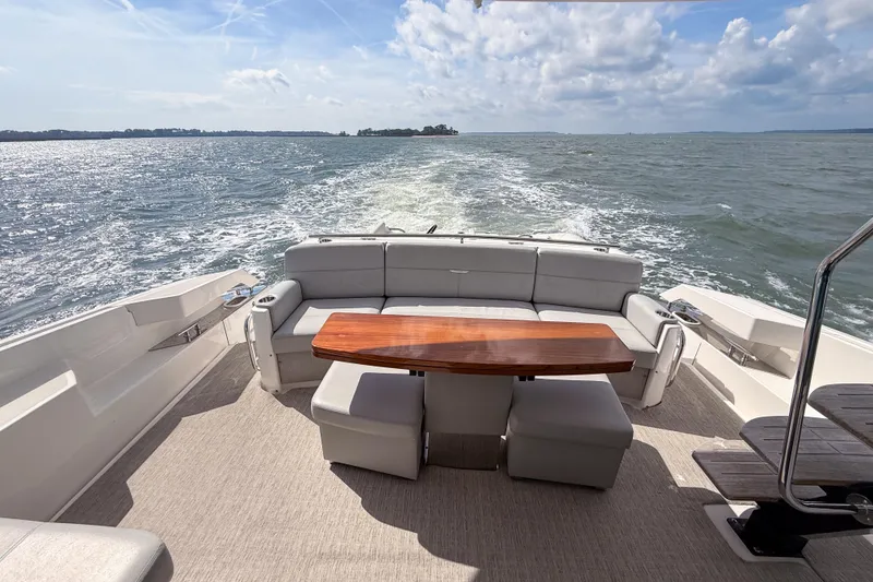 Slide: The Image of 2019 Tiara Yachts F53 Flybridge with elegant seating and ocean view. - 33