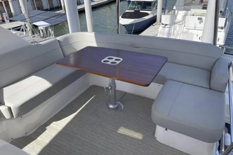 Slide: The Image of 2019 Tiara Yachts F53 Flybridge cruising on open water. - 4