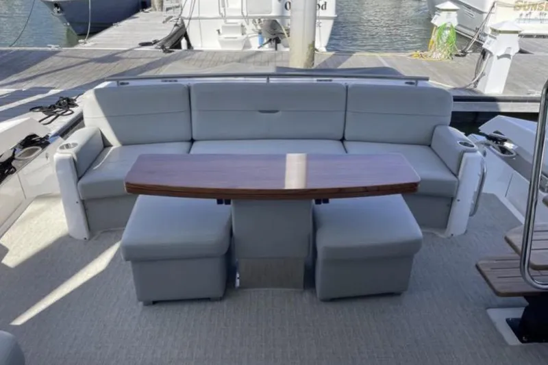 Slide: The Image of 2019 Tiara Yachts F53 Flybridge cruising on open water. - 5