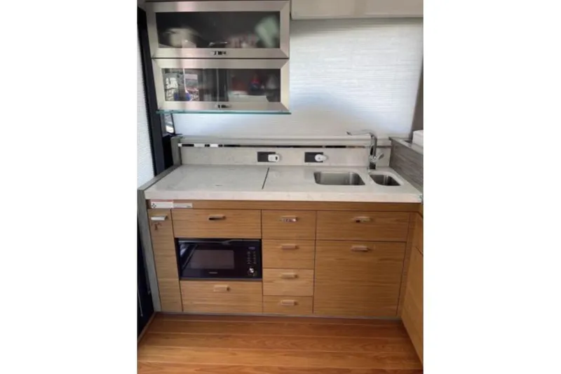 Slide: The Image of 2019 Tiara Yachts F53 Flybridge cruising on open water. - 6