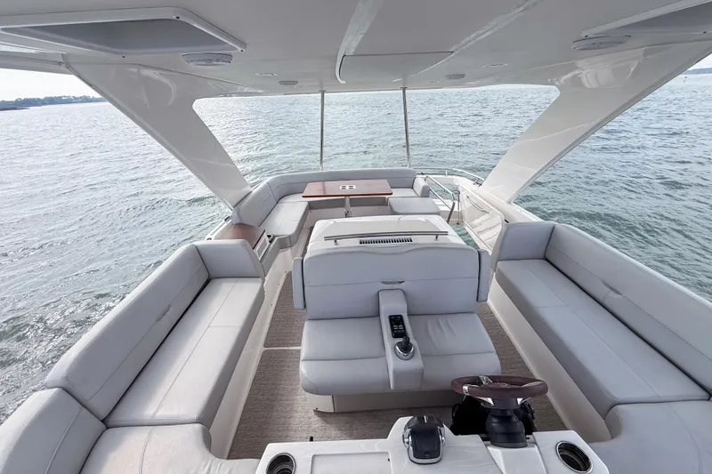 Slide: The Image of 2019 Tiara Yachts F53 Flybridge interior with spacious seating and ocean view. - 60
